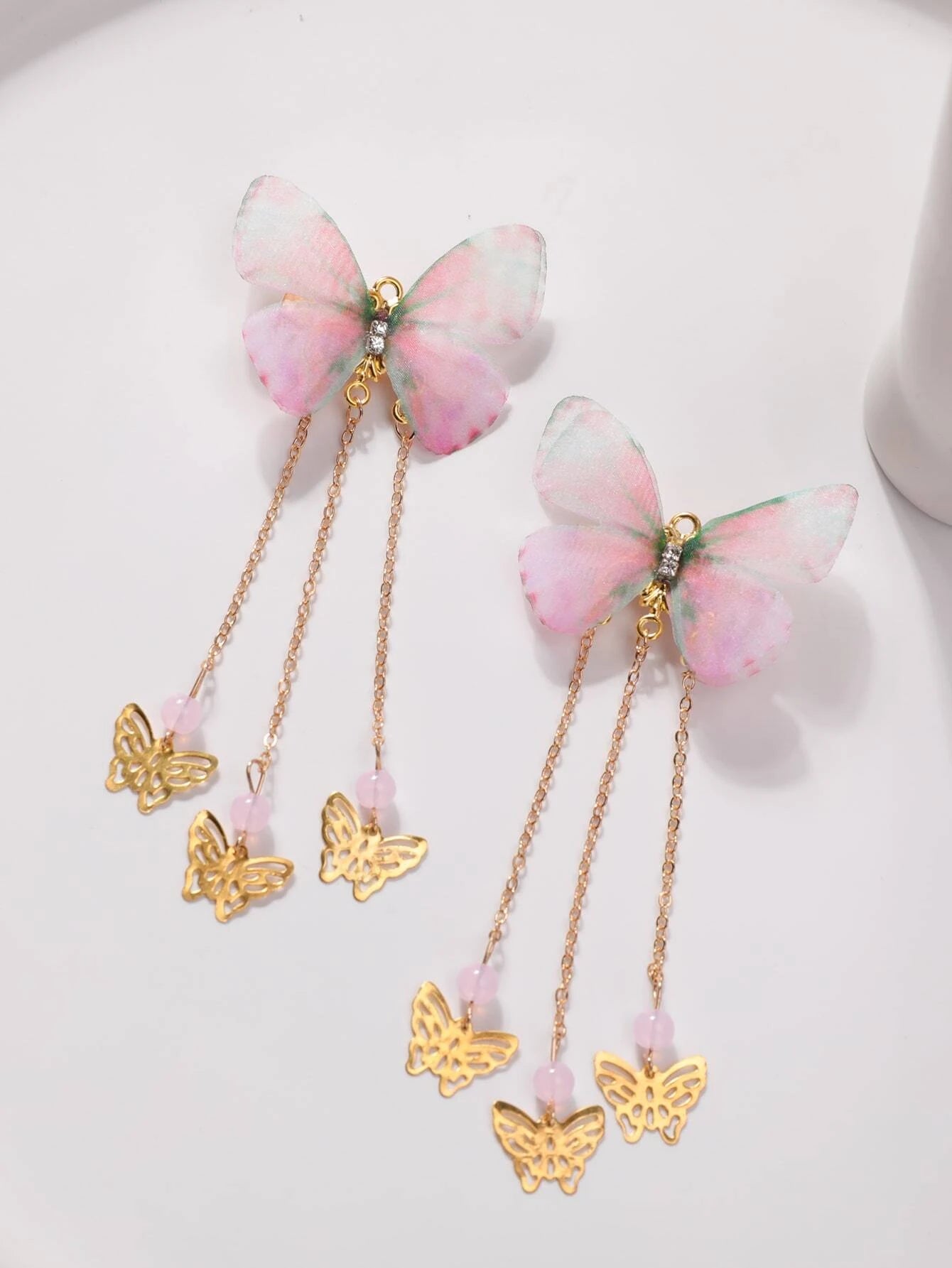 2x Haarclip met roze vlinder en kwastjes